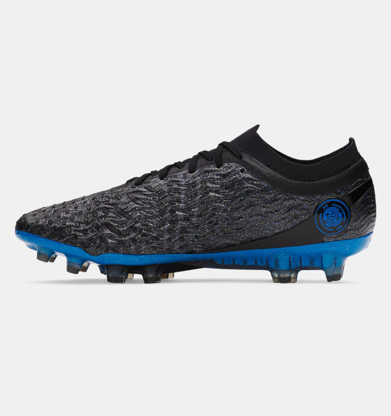 Under Armour Magnetico Elite 5 FG soccer cleats in black and blue with textured upper, side view
