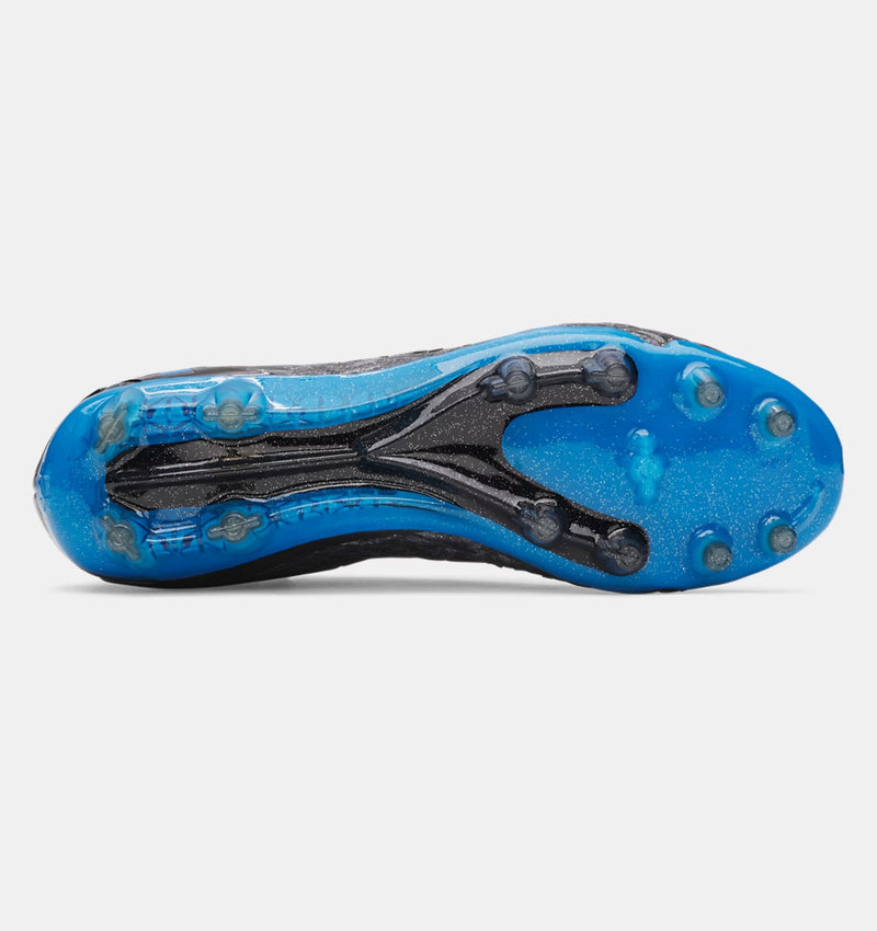 Under Armour Magnetico Elite 5 FG soccer cleats outsole with blue and black plate, featuring conical studs, bottom view.
