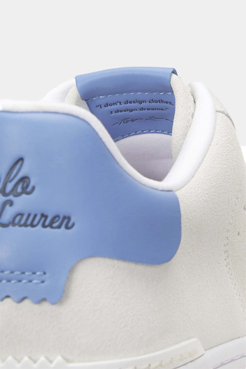 Polo Ralph Lauren Masters Court Suede sneakers in white suede with light blue leather accents, close-up view of heel counter and embossed logo.