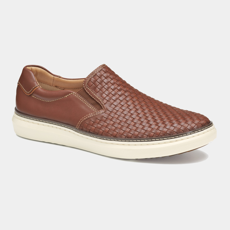 Johnston & Murphy McGuffey 2 Woven Slip-on shoes in brown leather with a woven upper design and white rubber sole, side view.