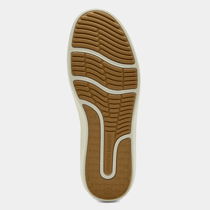 Johnston & Murphy McGuffey 2 Woven Slip-on outsole showing tan rubber tread pattern and branding, bottom view.