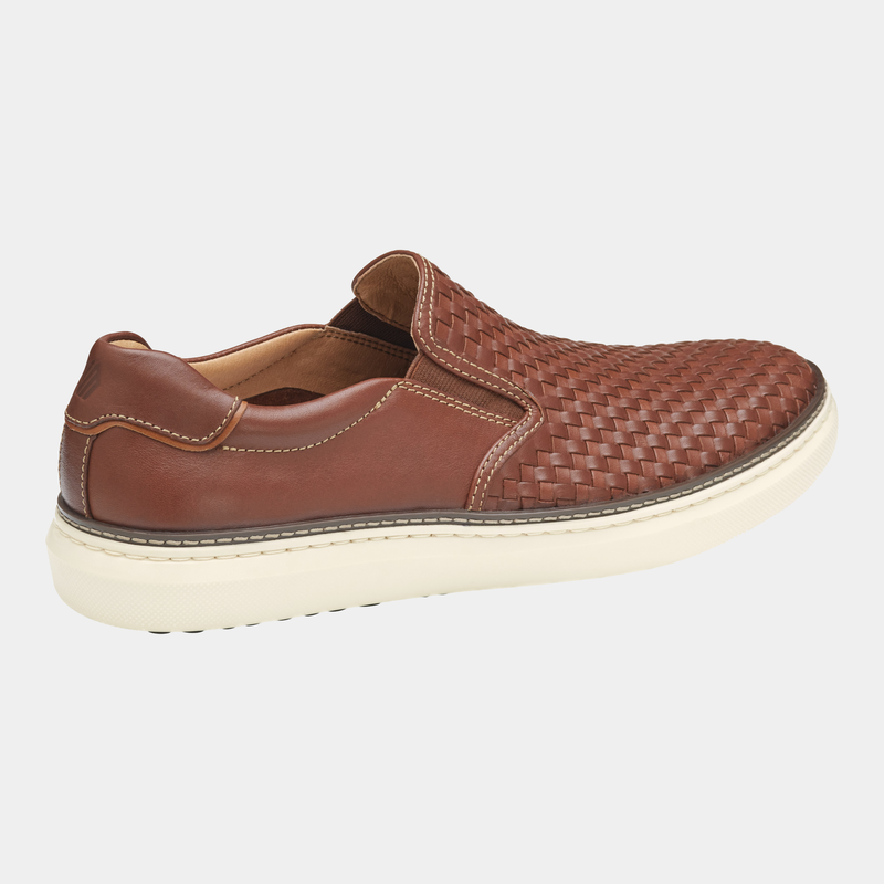 Johnston & Murphy McGuffey 2 Woven Slip-on shoes in brown leather with woven detailing and white rubber sole, side view.