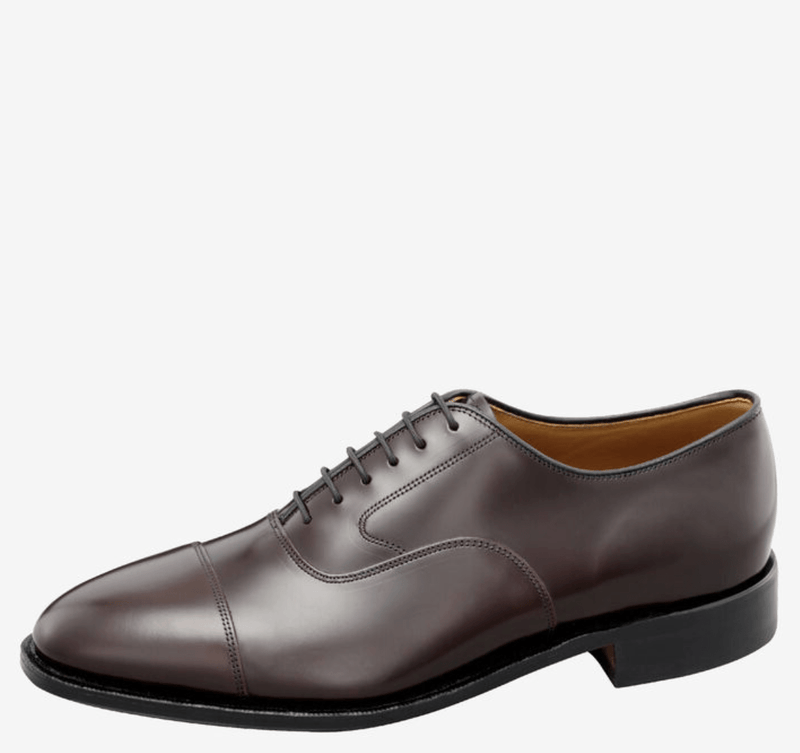 Johnston & Murphy Melton Cap Toe dress shoe in dark brown leather with a polished finish, featuring a classic cap toe design and lace closure, side view.