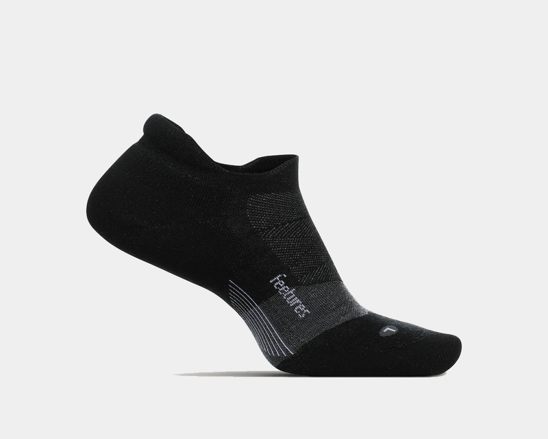 Feetures Merino 10 Ultra Light Cushion No Show Tab socks in black, featuring a low-cut design and targeted compression, side view.