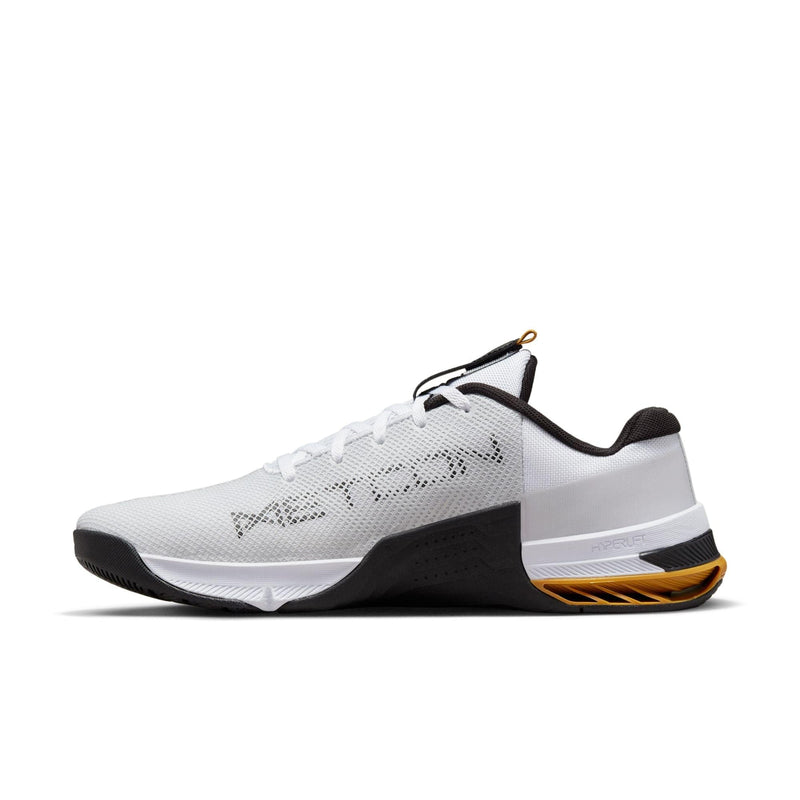 Nike Metcon 8 training shoes in white with black and yellow accents, breathable mesh upper and HyperLift heel support, side view.
