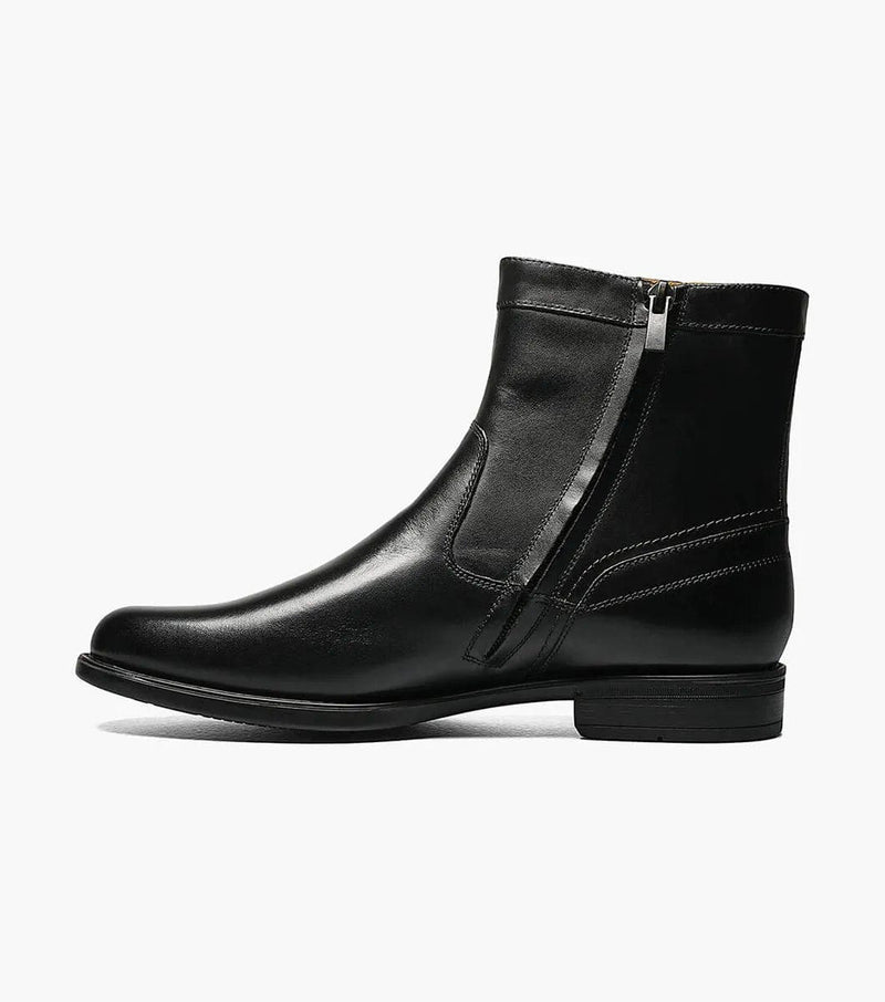 Florsheim Midtown PT Zipper Boot in black leather with polished finish, side zip closure, and stitched accents, side view.
