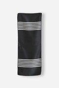 Nomadix Mini Towel in black with white horizontal stripe accents, lightweight and compact design, flat front view.