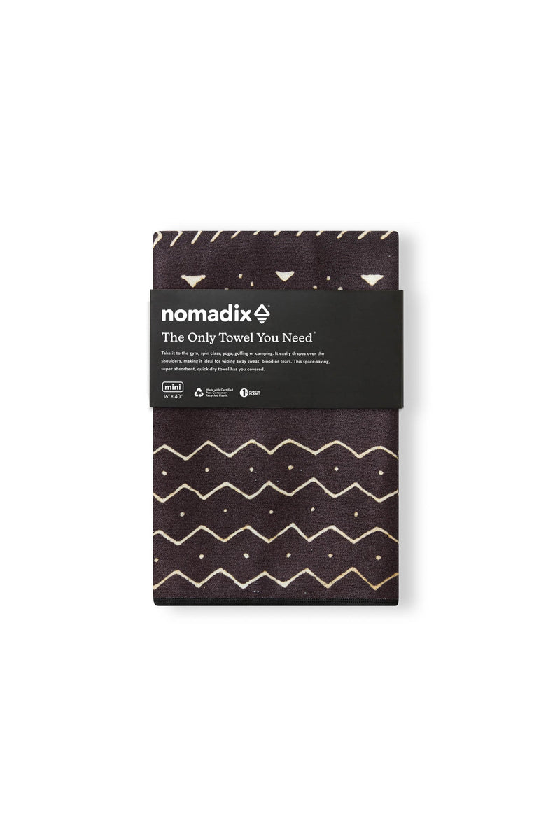 Nomadix Mini Towel in dark brown with beige geometric pattern and compact design, folded front view.