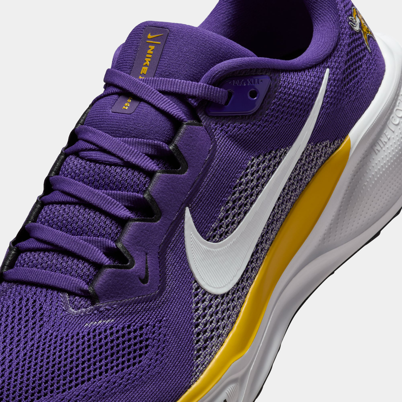 Nike Minnesota Vikings Pegasus 41 running shoes in purple with team branding, white Swoosh, and yellow accents, close-up side view.