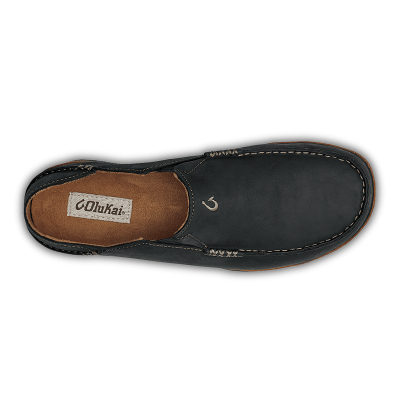 OluKai Moloa slip-on shoes with premium leather upper in black, contrast stitching, and cushioned insole, top view.