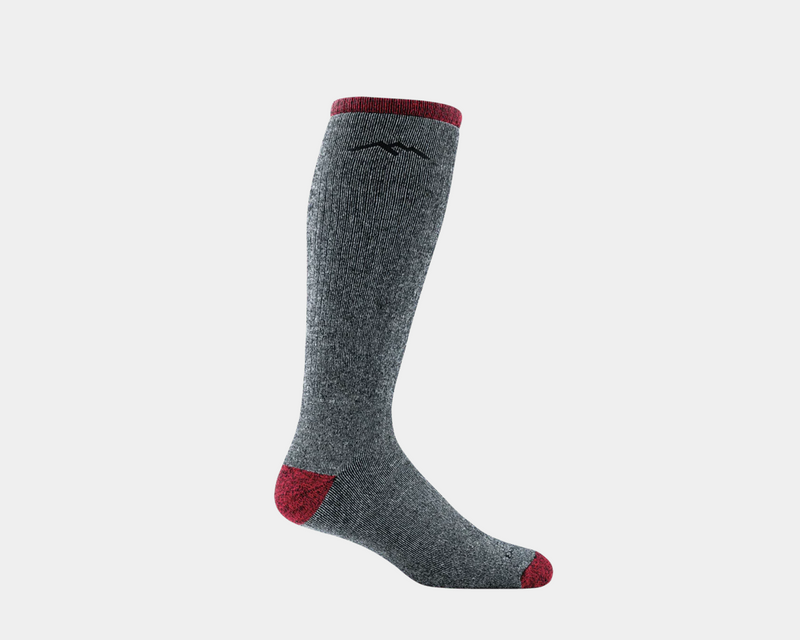 Darn Tough Mountaineering Over-The-Calf Extra Cushion socks in gray with red accents on toe and cuff, side view.