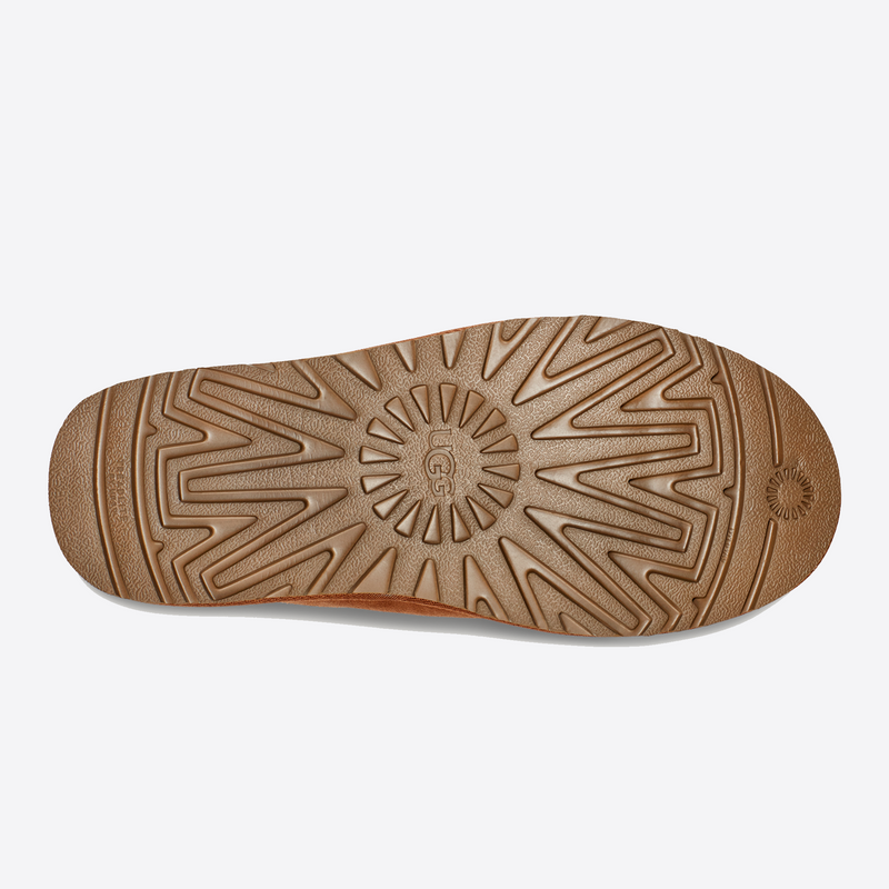UGG Neuman shoes outsole in tan showing textured tread pattern and embossed UGG branding.