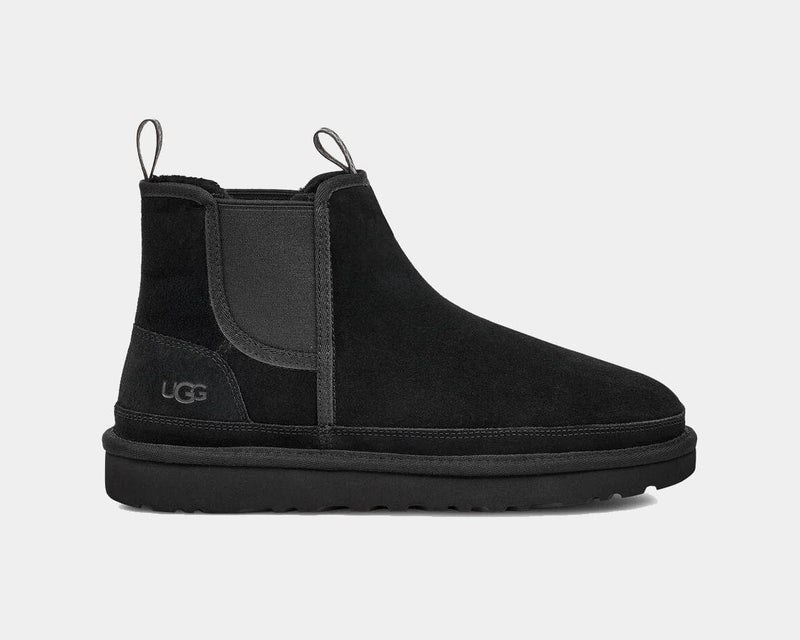 UGG Neumel Chelsea boots in black suede with elastic side panels and pull tabs, side view.