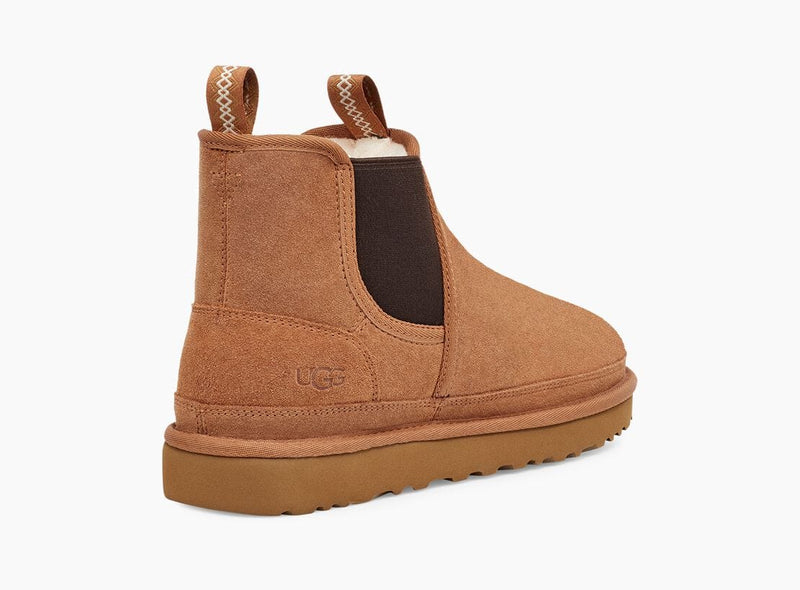 UGG Neumel Chelsea boots in chestnut brown suede with elastic side panels, pull tabs, and rubber outsole, side view.