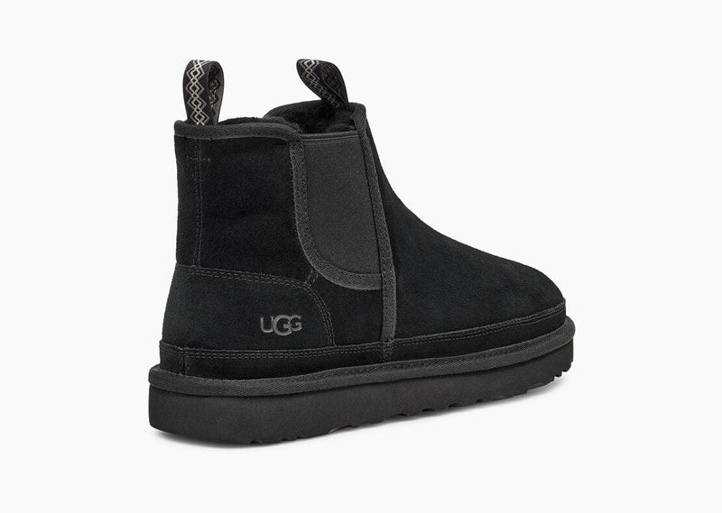 UGG Neumel Chelsea boots in black suede with elastic side panels and pull tabs, back angle view.