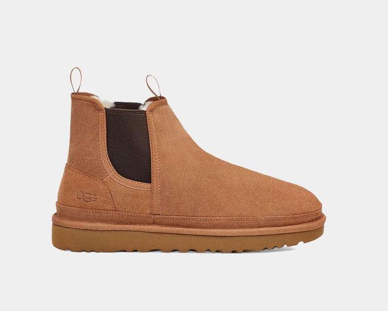 UGG Neumel Chelsea boots in chestnut suede with elastic side panels and pull tabs, side view.