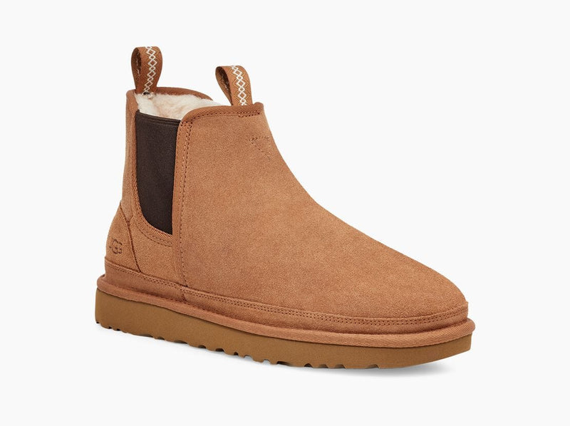 UGG Neumel Chelsea boots in chestnut brown suede with elastic side panels, pull tabs, and cushioned outsole, side view.