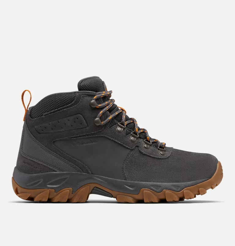 Columbia Newton Ridge™ Plus II Suede WP hiking boots in black suede with orange accents and durable rubber outsole, side view.