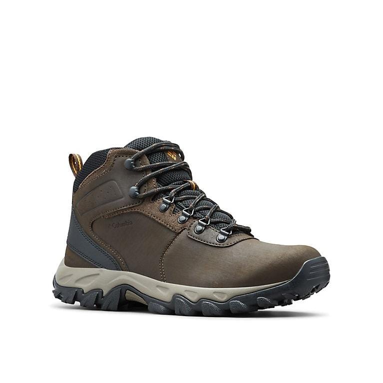 Columbia Newton Ridge Plus II Waterproof hiking boots in brown leather with gray mesh panels, metal eyelets, and rugged rubber outsole, side view.