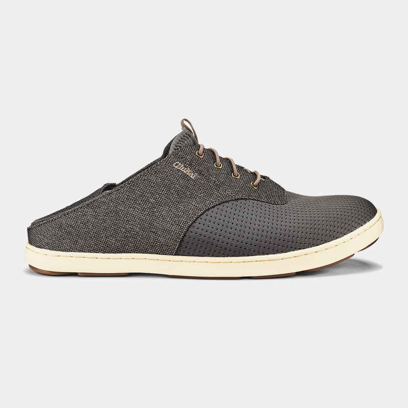 OluKai Nohea Moku sneakers in dark gray with mesh forefoot, textured side panels, and white rubber sole, side view.