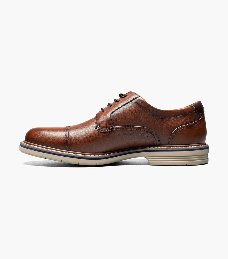Florsheim Norwalk Cap Toe Oxford shoes in rich brown leather with a stitched cap toe and cushioned sole, side view.
