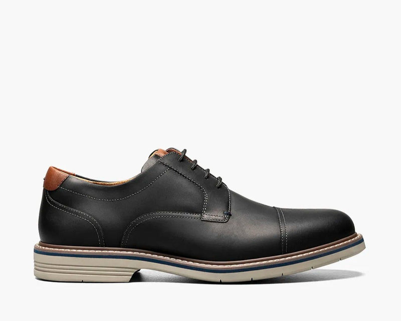 Florsheim Norwalk Cap Toe Oxford shoes in black leather with tan accents, cap toe design, and durable contrast sole, side view.