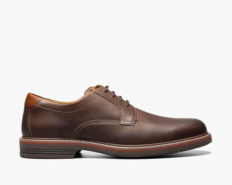 Florsheim Norwalk Plain Toe Oxford shoes in dark brown leather with contrast stitching and cushioned sole, side view.