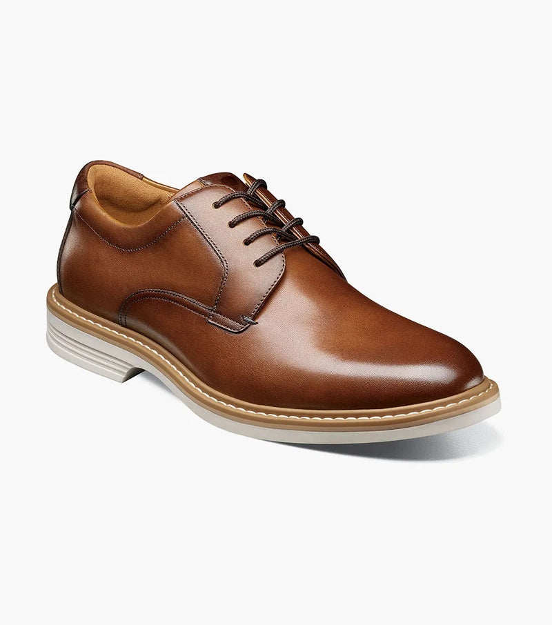 Florsheim Norwalk Plain Toe Oxford shoes in tan leather with closed lacing, padded collar, and lightweight white sole, angled side view.