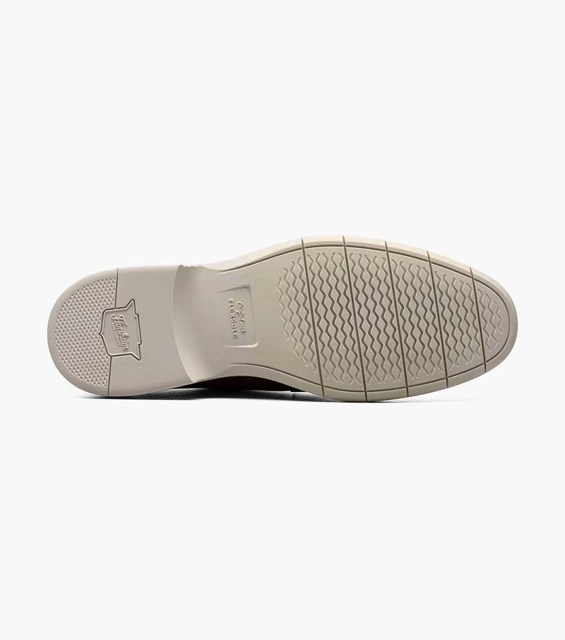 Florsheim Norwalk Plain Toe Oxford sole view showing textured rubber outsole in light beige with branding detail.