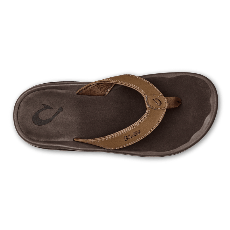 OluKai Ohana sandals with brown synthetic straps and dark brown cushioned footbed, top view.