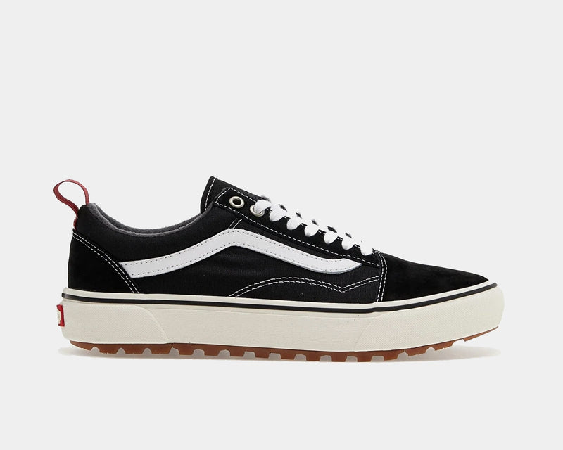 Vans Old Skool MTE sneakers in black with white sidestripe, suede and canvas upper, rugged gum outsole, side view.