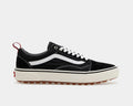 Vans Old Skool MTE sneakers in black with white sidestripe, suede and canvas upper, rugged gum outsole, side view.
