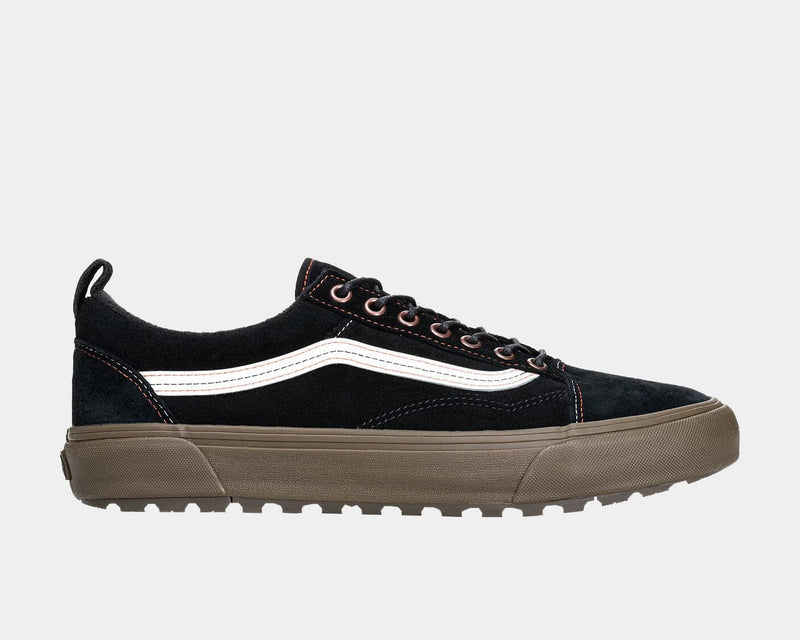 Vans Old Skool MTE shoes in black suede with brown rugged sole, white side stripe, and reinforced eyelets, side view.