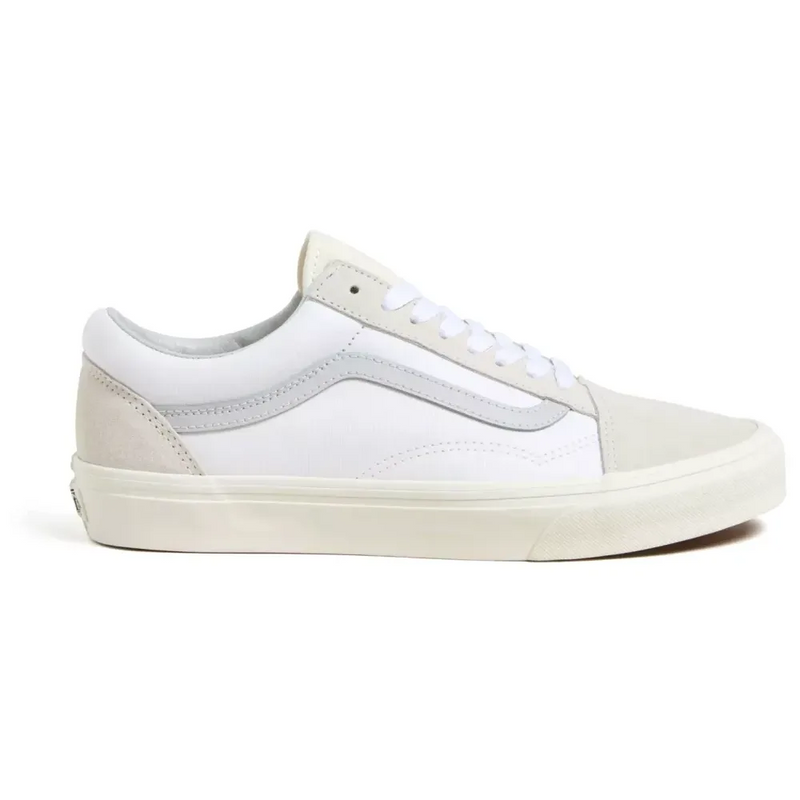 Vans Old Skool sneakers in white canvas with beige suede overlays and signature side stripe, side view.