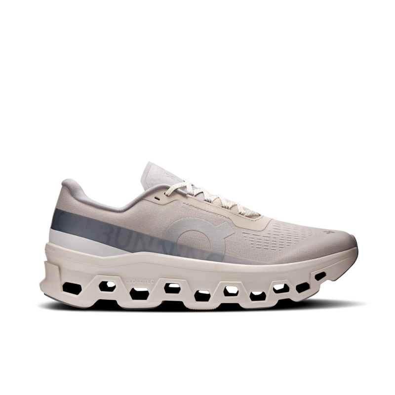 Beige running shoe with unique sole design on a white background