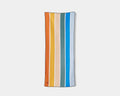 Nomadix Original Towel featuring vibrant striped design in orange, yellow, teal, blue, and beige, front view.