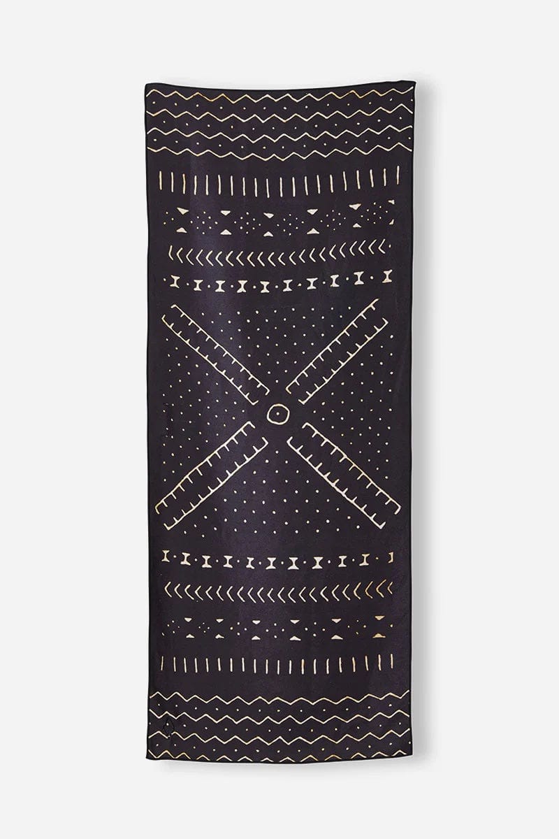 Nomadix Original Towel in black with geometric tan patterns, lightweight and versatile, front view.