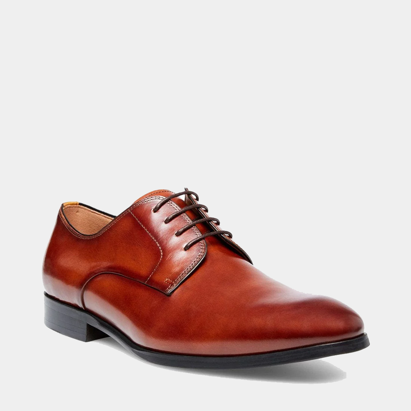 Steve Madden Parsens Leather Oxford dress shoes in brown leather with closed lacing and stacked heel, side angle view.