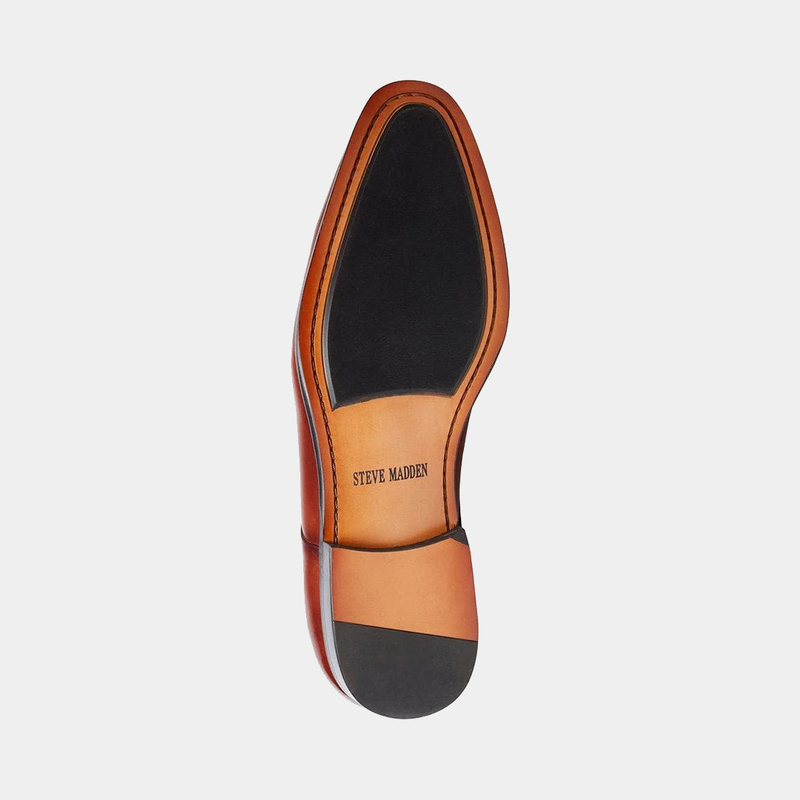 Steve Madden Parsens Leather Oxford outsole view featuring black and tan details with branded logo imprint.