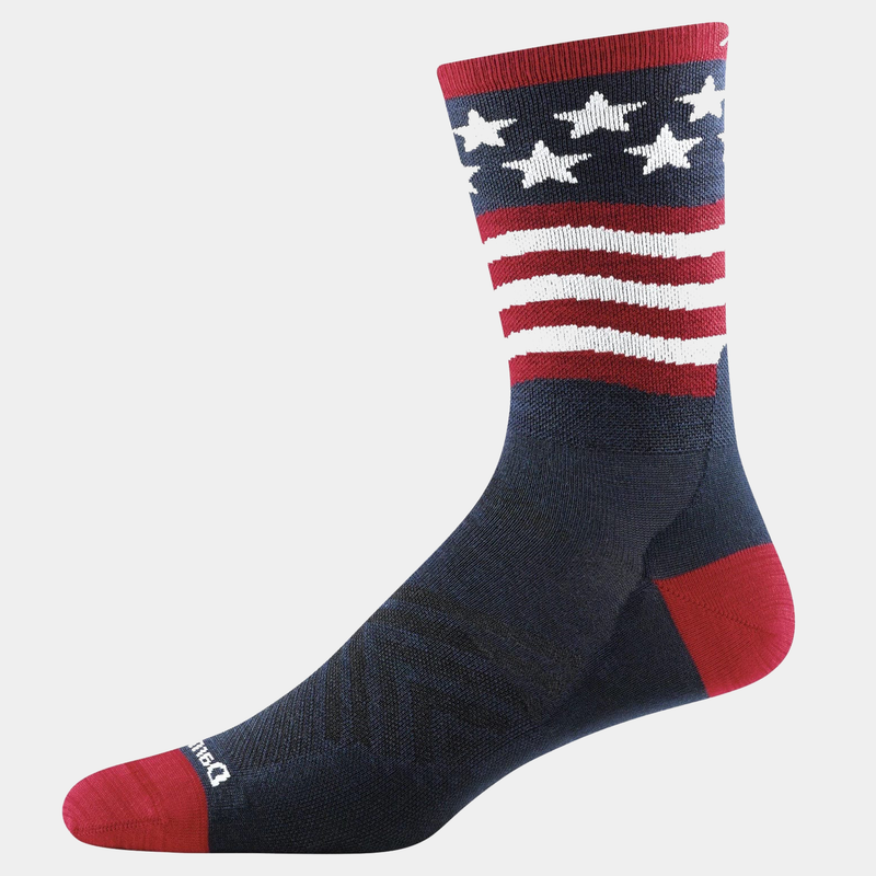 Darn Tough Patriot Micro Crew Ultra-Lightweight Running socks in navy blue with red and white stars-and-stripes design, side view.