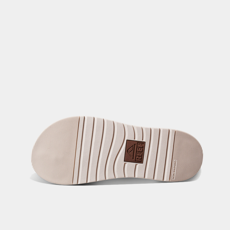 Reef Phantom Bronzer sandal outsole with textured non-marking rubber in beige and brown featuring Reef logo.
