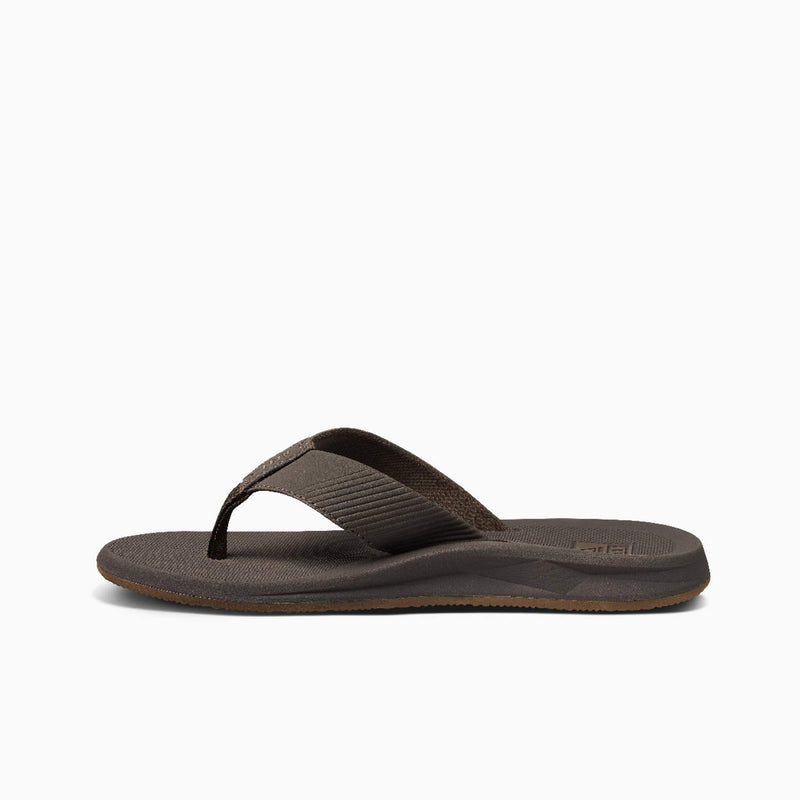 Reef Phantom II sandals in brown with textured strap and cushioned footbed, side view showing sleek sole design.