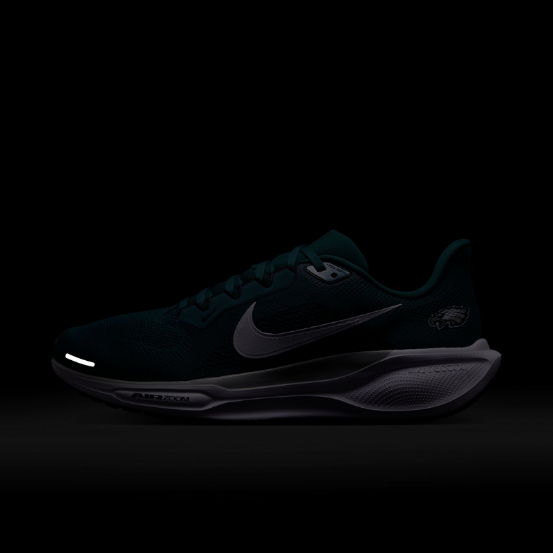 Nike Philadelphia Eagles Pegasus 41 running shoes in dark green with team logo and reflective details, side view.