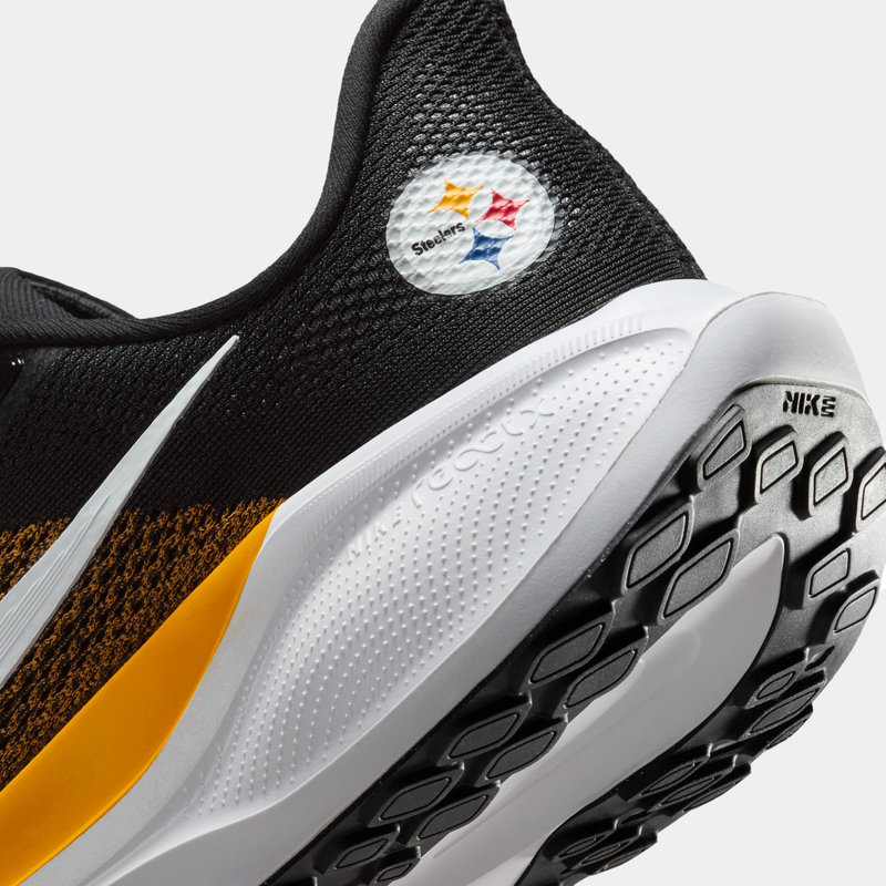 Nike Pittsburgh Steelers Pegasus 41 running shoes in black, yellow, and white with Steelers logo and Nike React sole, close-up heel view.