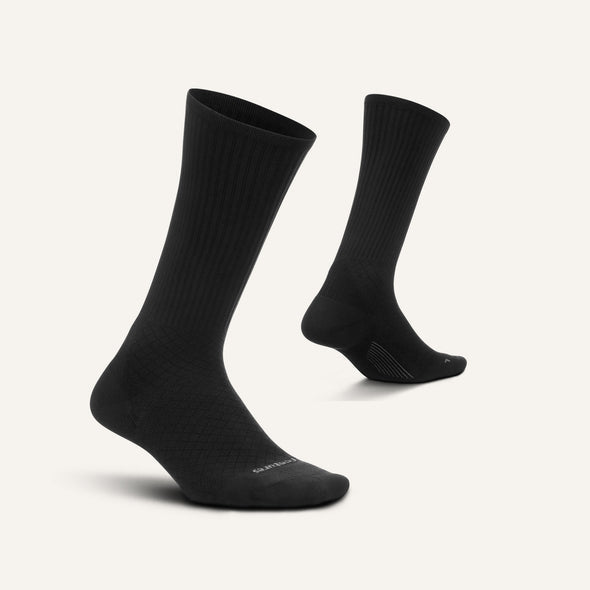 Feetures Plantar Fasciitis Relief Sock Light Cushion Crew socks in black with ribbed cuffs and targeted arch compression, side angle.