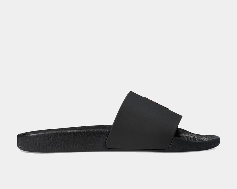 Polo Ralph Lauren Polo Signature Slide sandals in black with wide strap and textured footbed, side view.