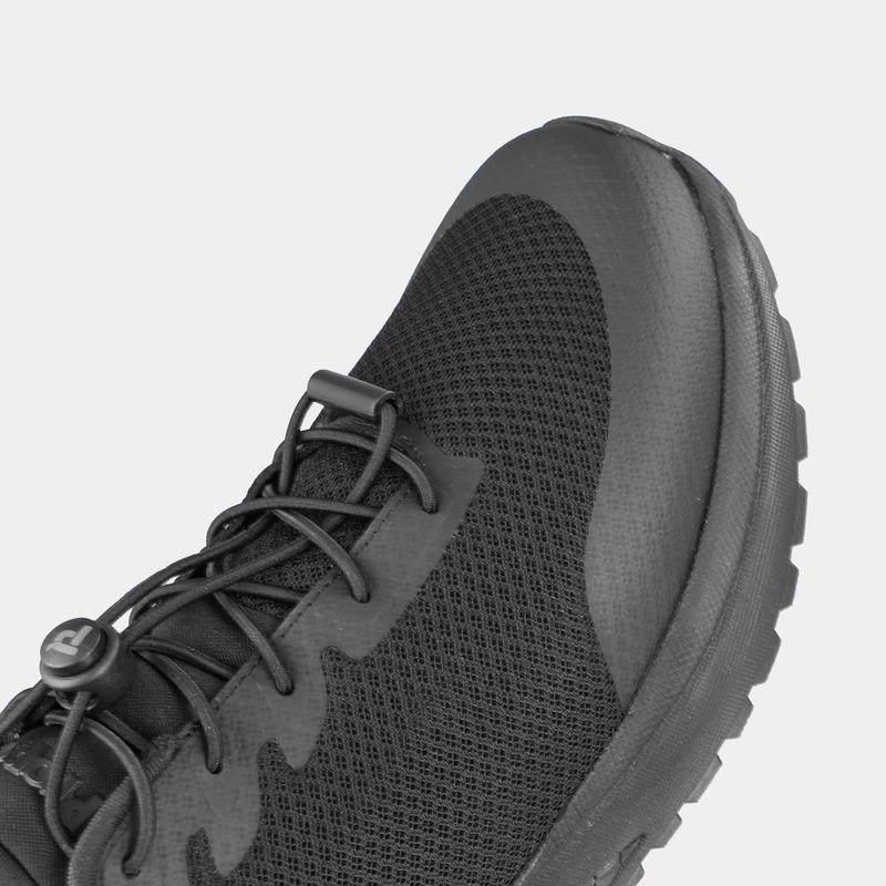 Propét One Velocity Step-In Sneaker in black with breathable mesh upper, elastic lace closure, and durable sole, close-up of toe box.