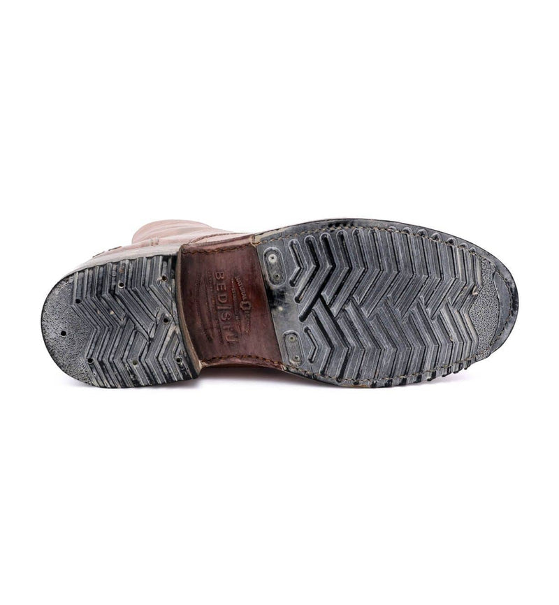 Bed Stu Protege Vintage Finish shoe outsole in black rubber with textured tread pattern and engraved logo, sole view.