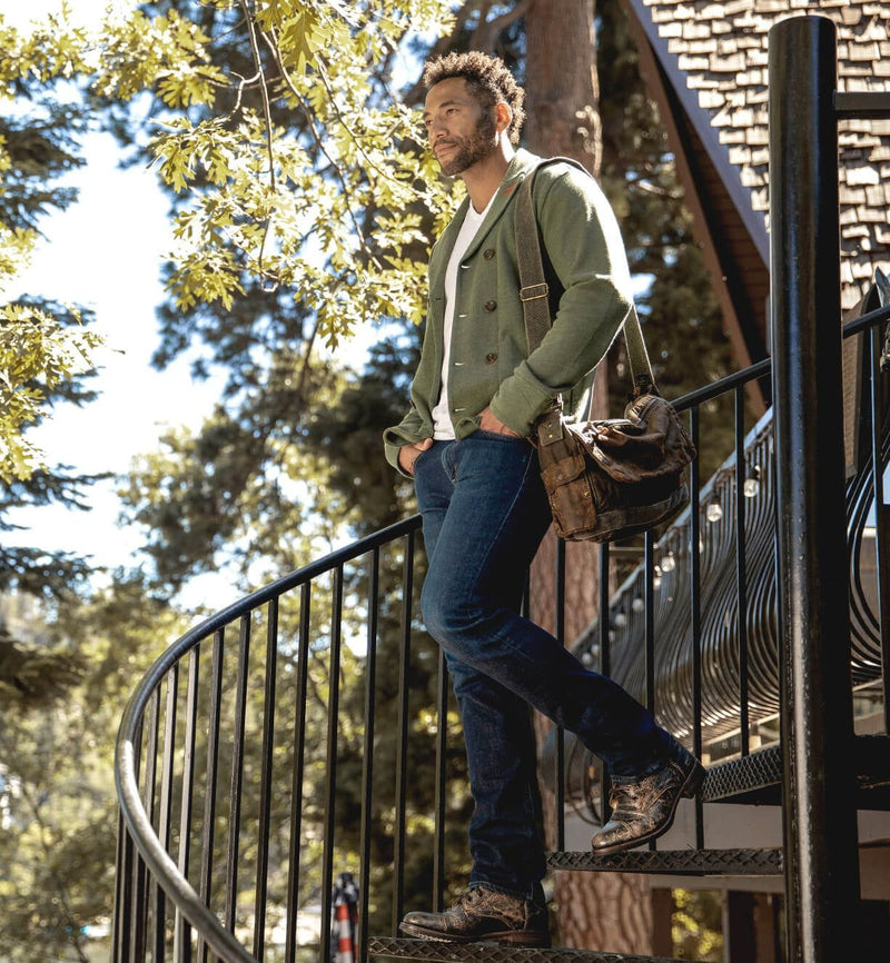 Bed Stu Protege boots in distressed brown leather with lace-up design and handcrafted details, worn outdoors with denim style.