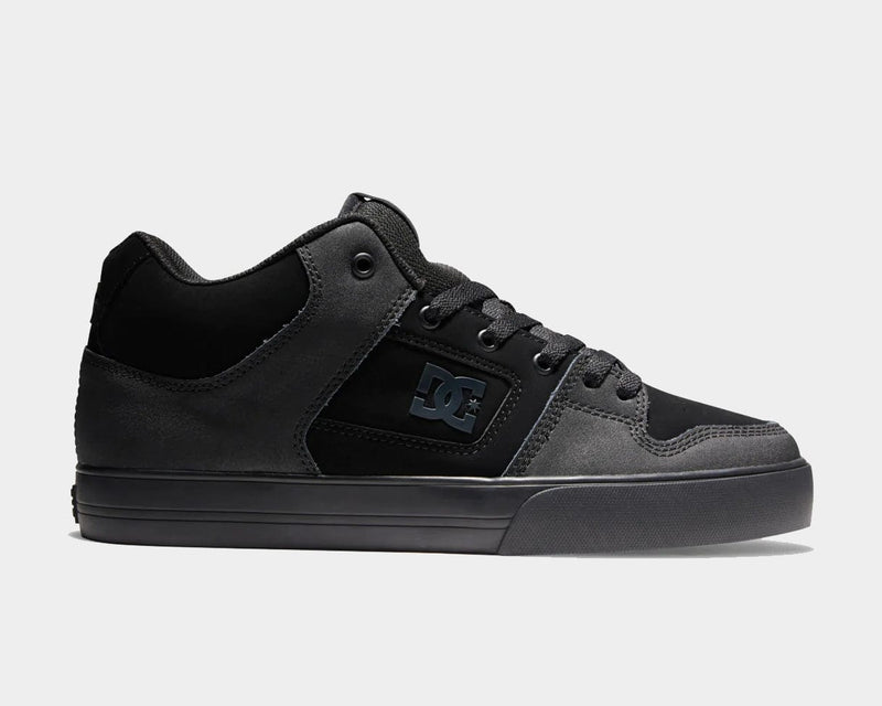 DC Footwear Pure Mid skate shoes in black with suede and leather materials, tonal DC logo, and padded collar, side view.